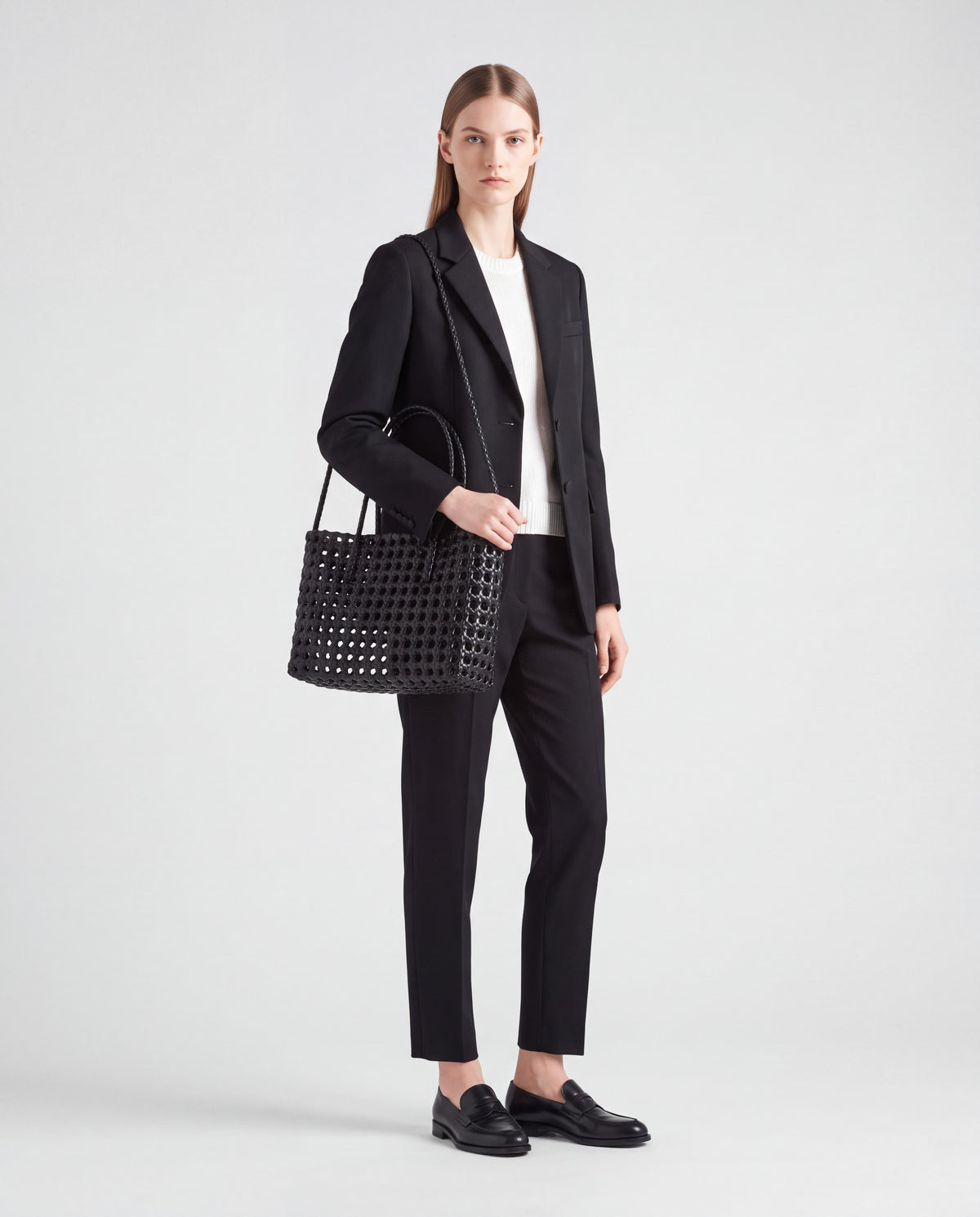 Lattice bag in Black – worn by model, full length