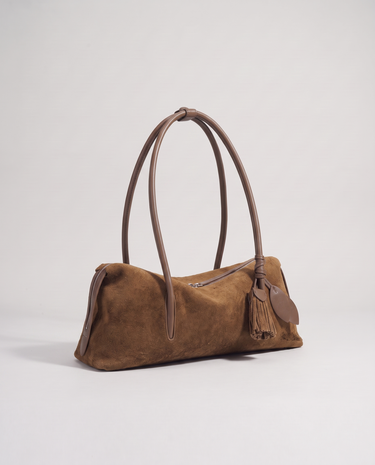 Isola suede shoulder bag in brown, three-quarter view