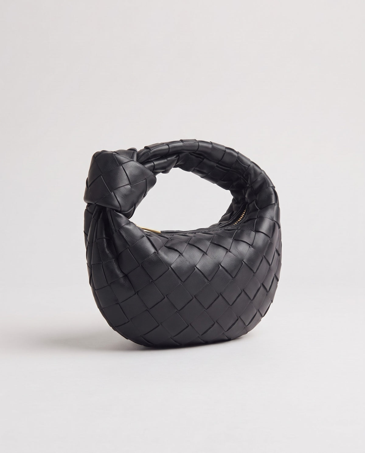 Knot Mini woven leather bag in Black – three-quarter view