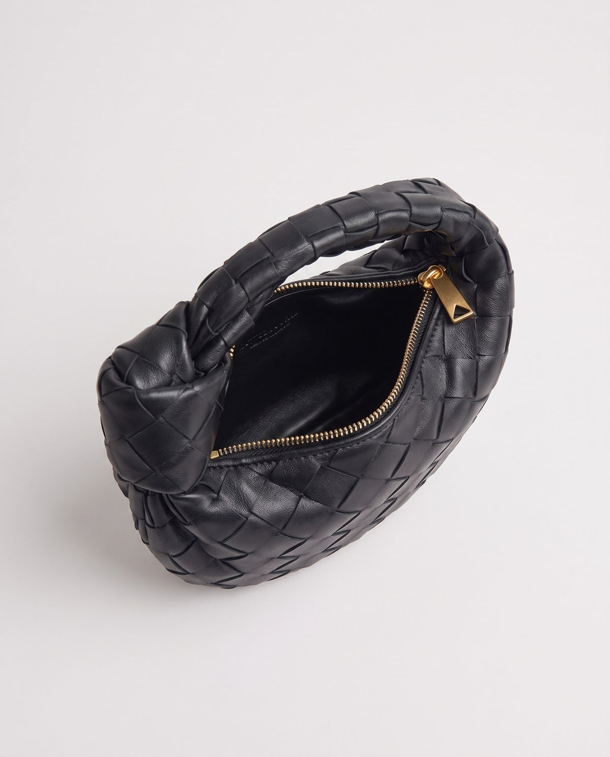Knot Mini woven leather bag in Black – inside view with the zip open
