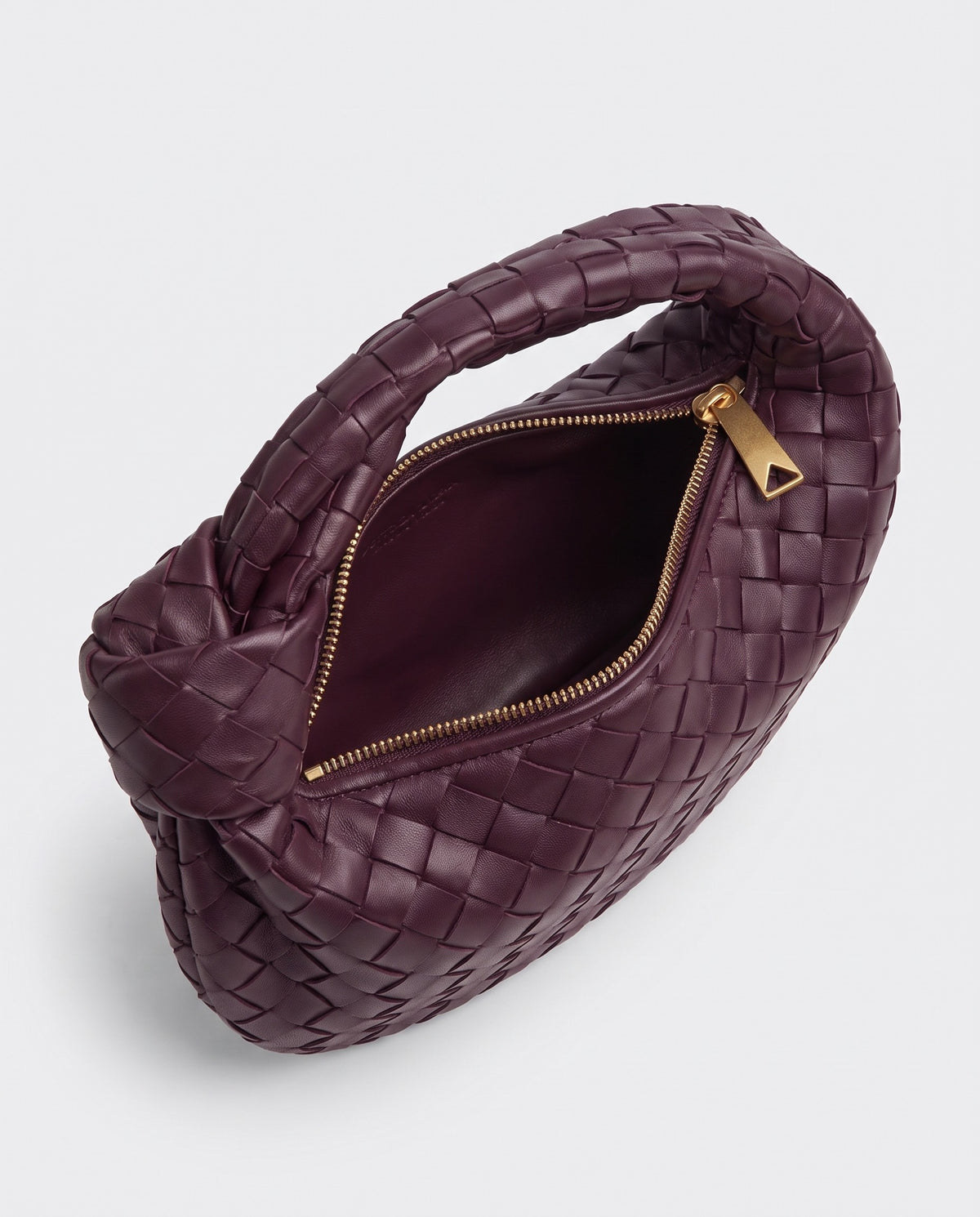 Knot Mini woven leather bag in Bordeaux – inside view with the zip open