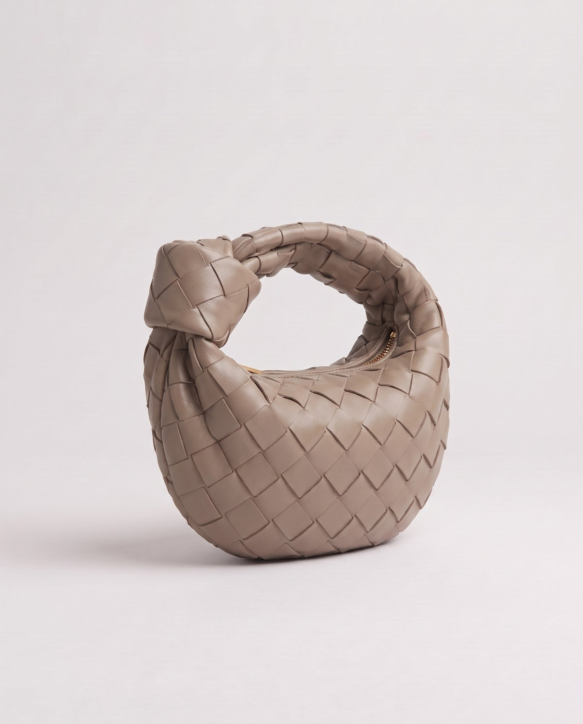 Knot Mini woven leather bag in Camel – three-quarter view