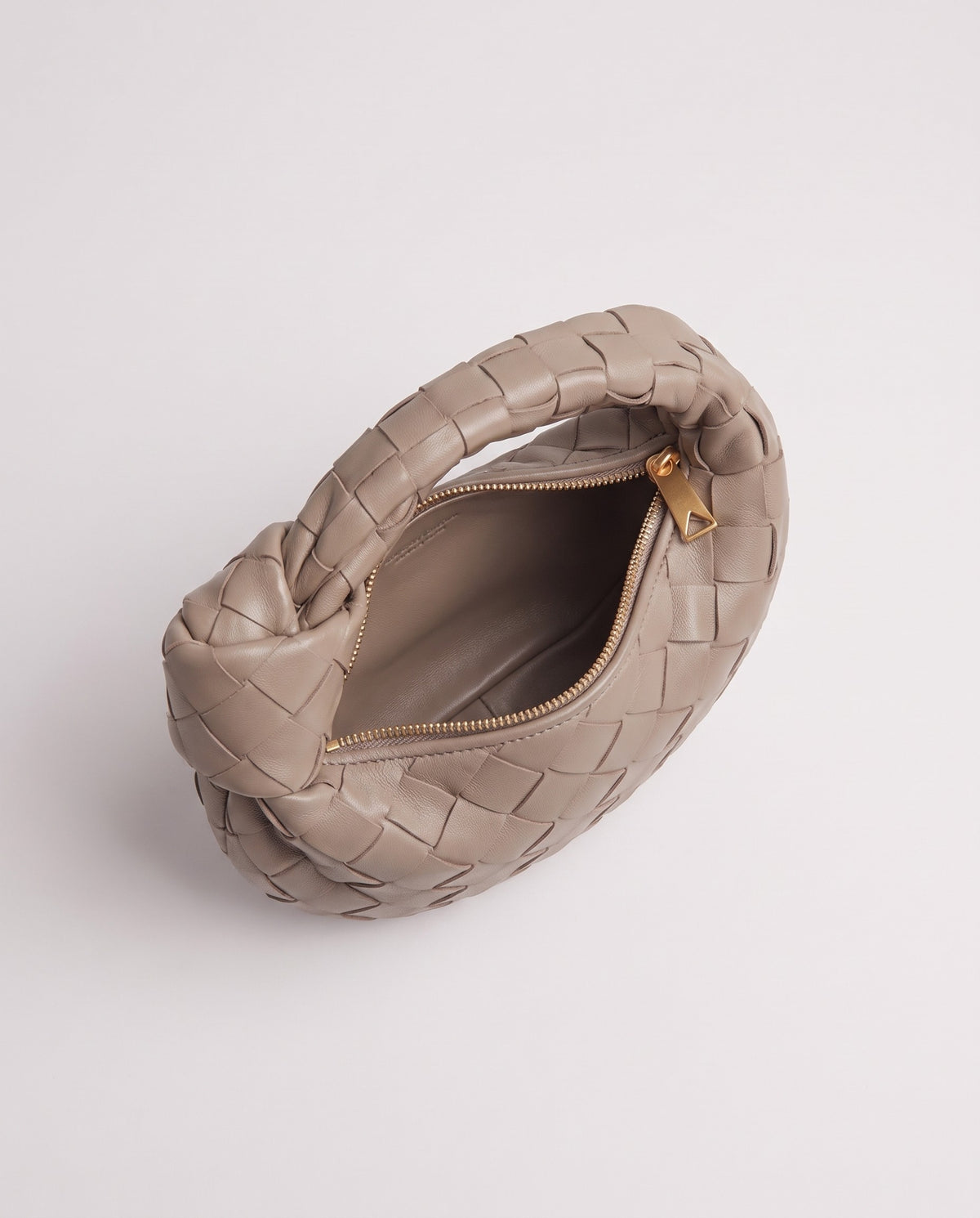 Knot Mini woven leather bag in Camel – inside view with the zip open