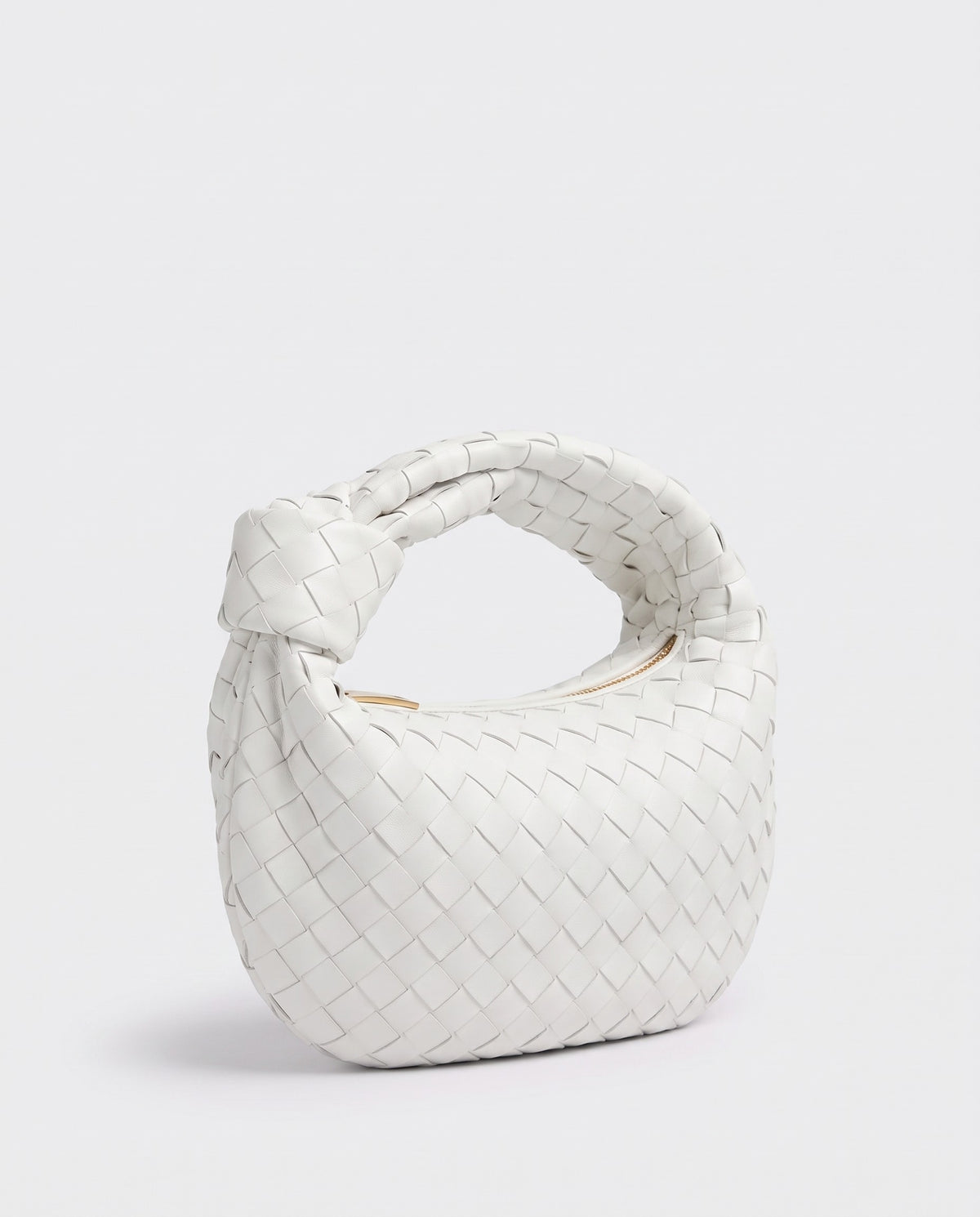 Knot Mini woven leather bag in Chalk – three-quarter view