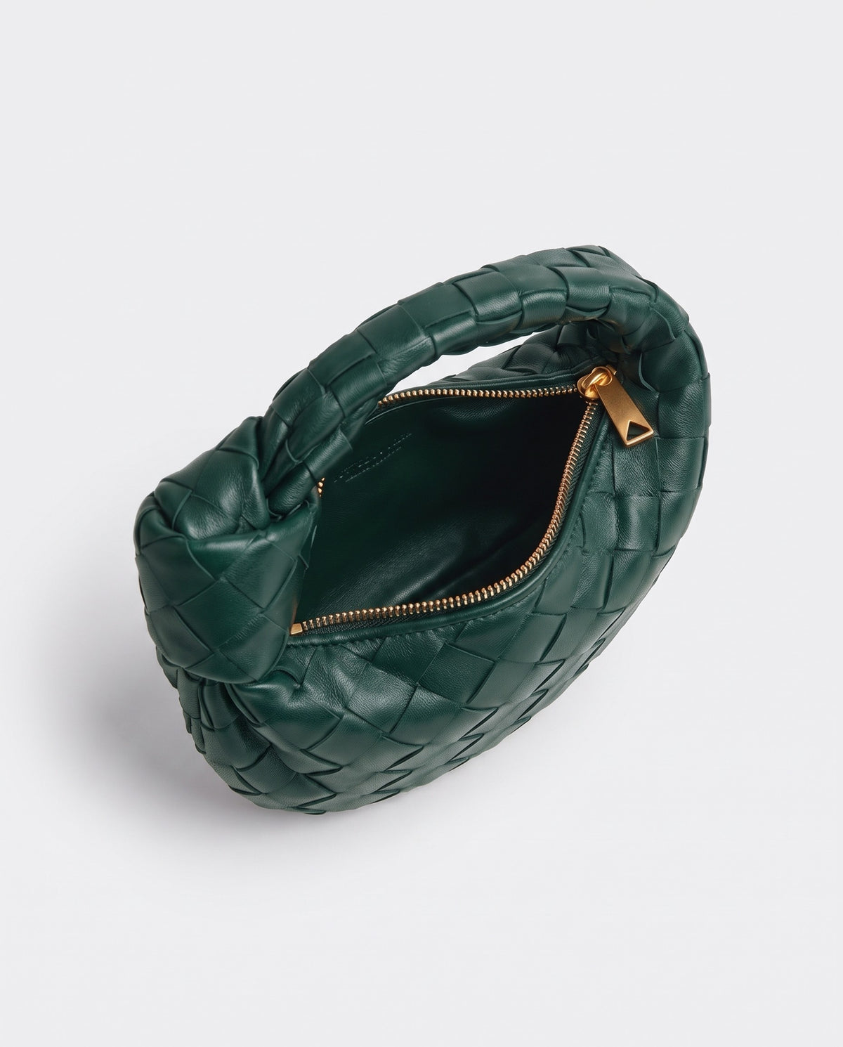 Knot Mini woven leather bag in Emerald – inside view with the zip open