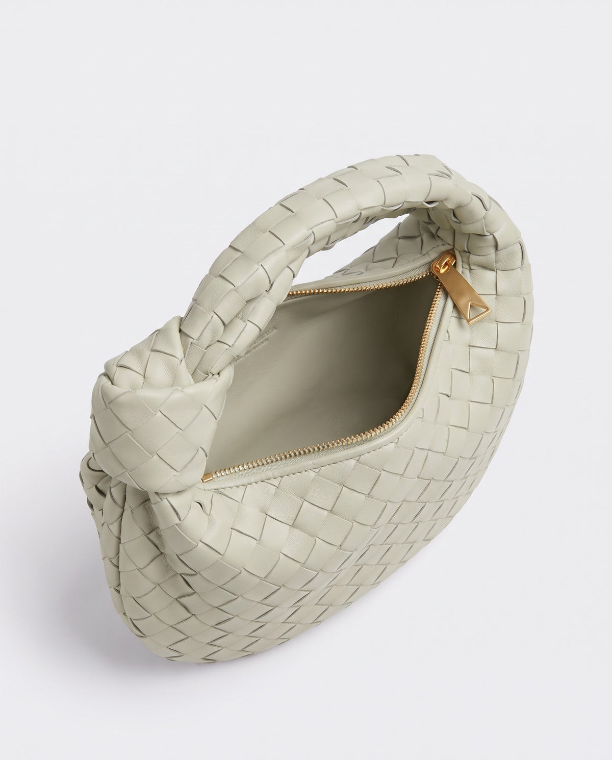 Knot Mini woven leather bag in Pistachio – inside view with the zip open