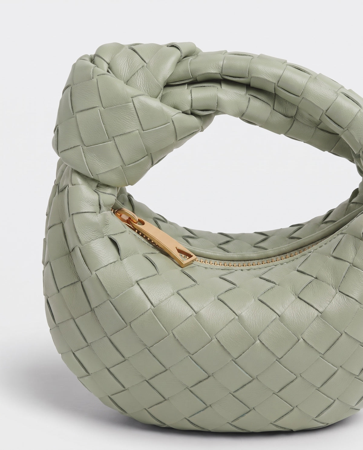 Knot Mini woven leather bag in Pistachio – close-up of the knotted handle