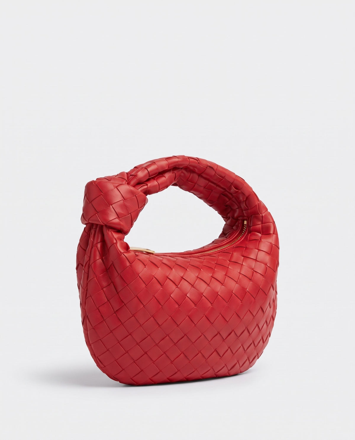Knot Mini woven leather bag in Scarlet – three-quarter view