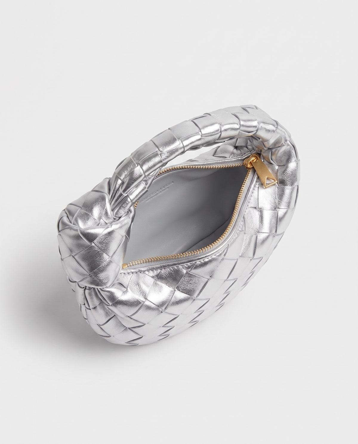 Knot Mini woven leather bag in Silver – inside view with the zip open