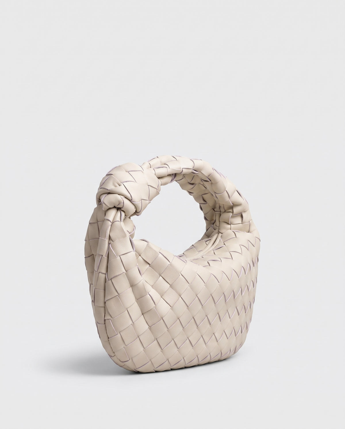 Knot Small woven leather bag in Chalk – three-quarter view