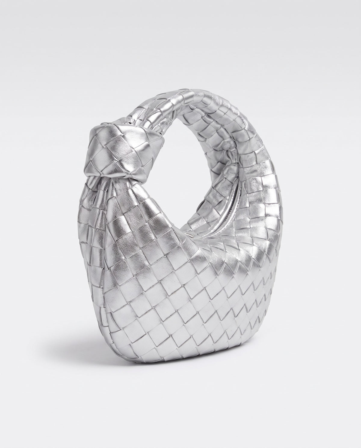 Knot Small woven leather bag in Silver – three-quarter view