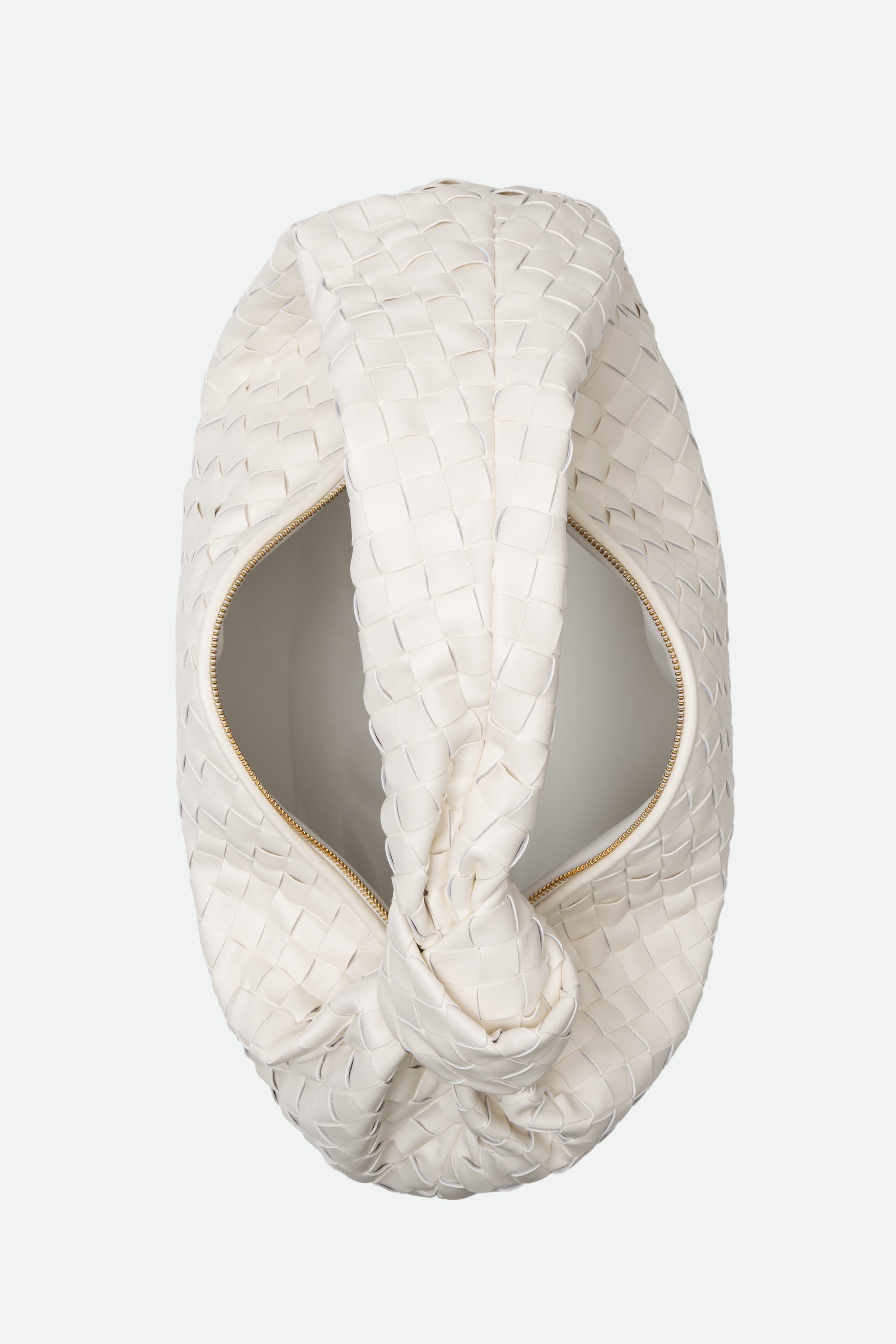 Top view of Large Knot Bag (Jodie), a woven beige handbag with a knotted handle