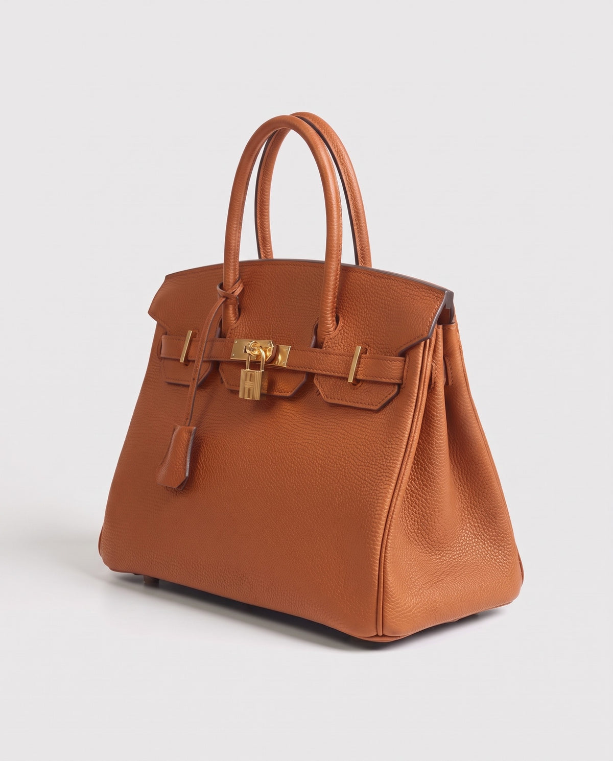 Lock Extra Large leather top-handle bag in Caramel – three-quarter view