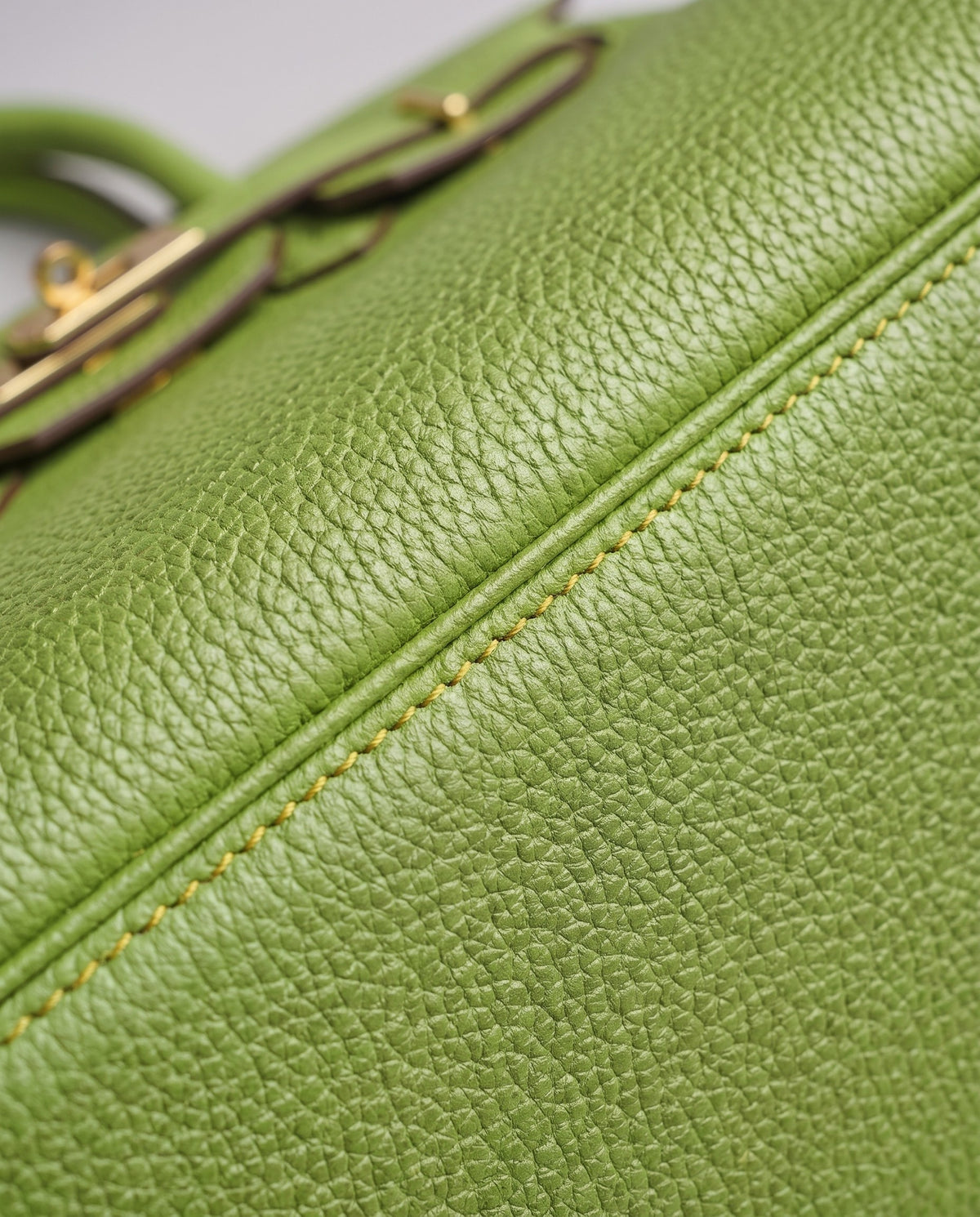Lock Large leather top-handle bag in Avocado – close-up of the pebbled leather and stitching