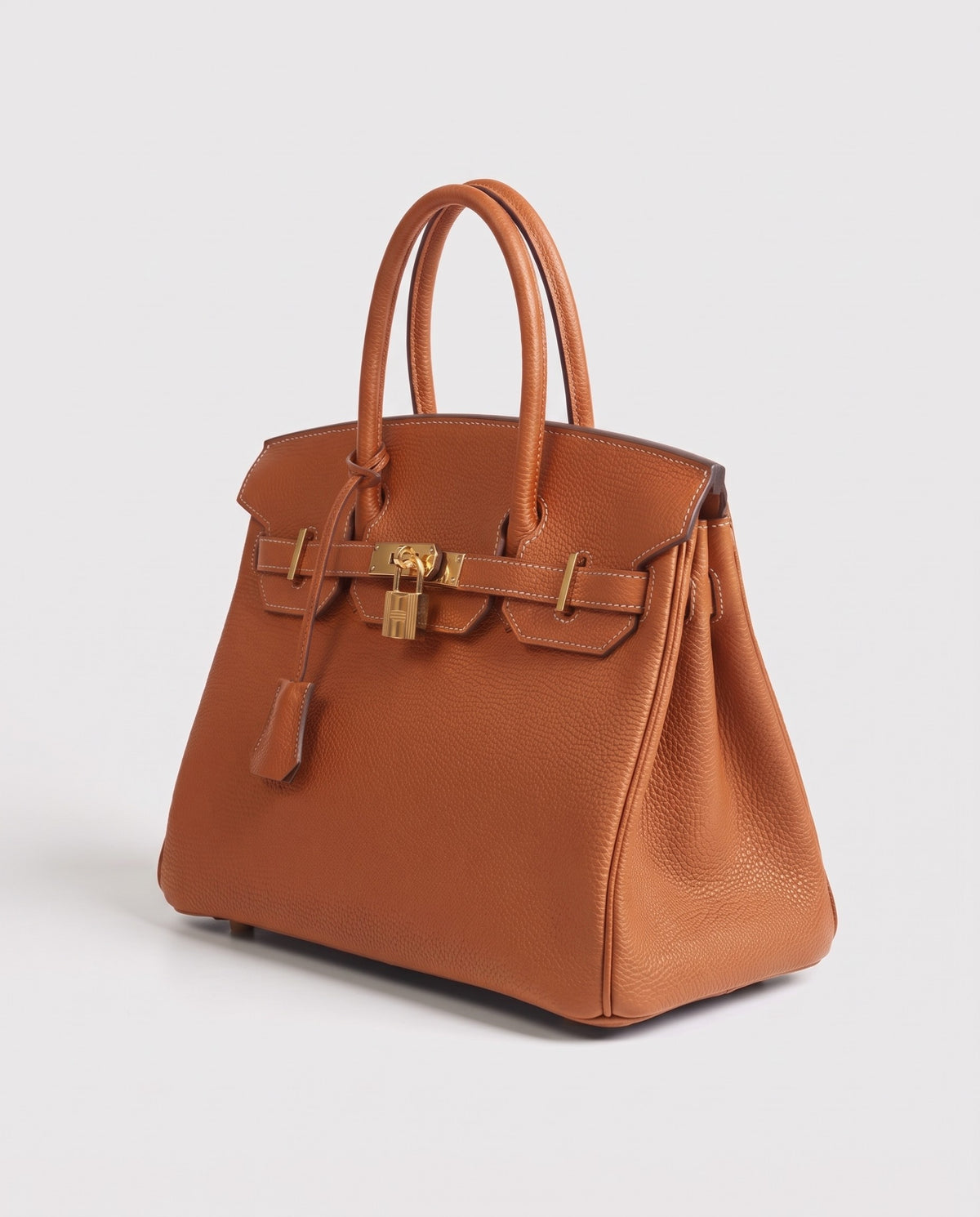 Lock Large leather top-handle bag in Caramel – three-quarter view