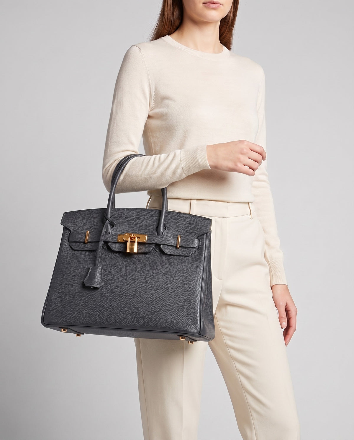Lock Large leather top-handle bag in Charcoal – model carrying it