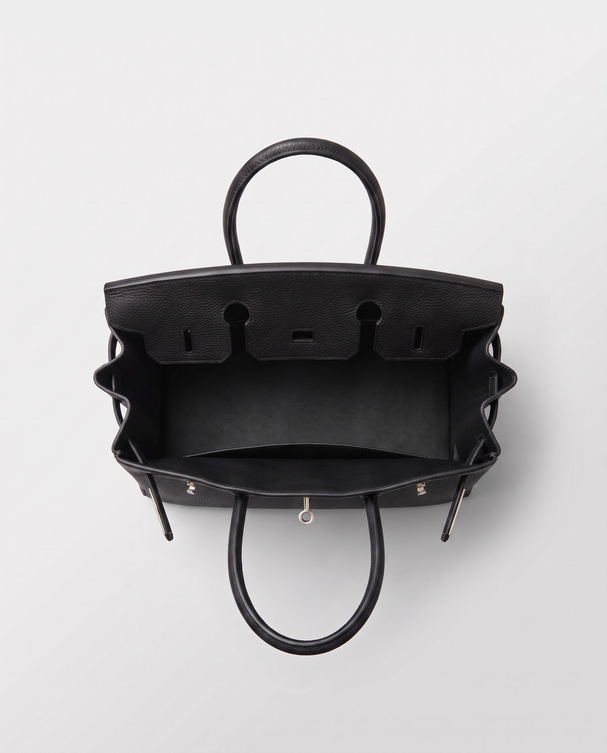 Lock Medium leather top-handle bag in Onyx – inside view showing the leather lining