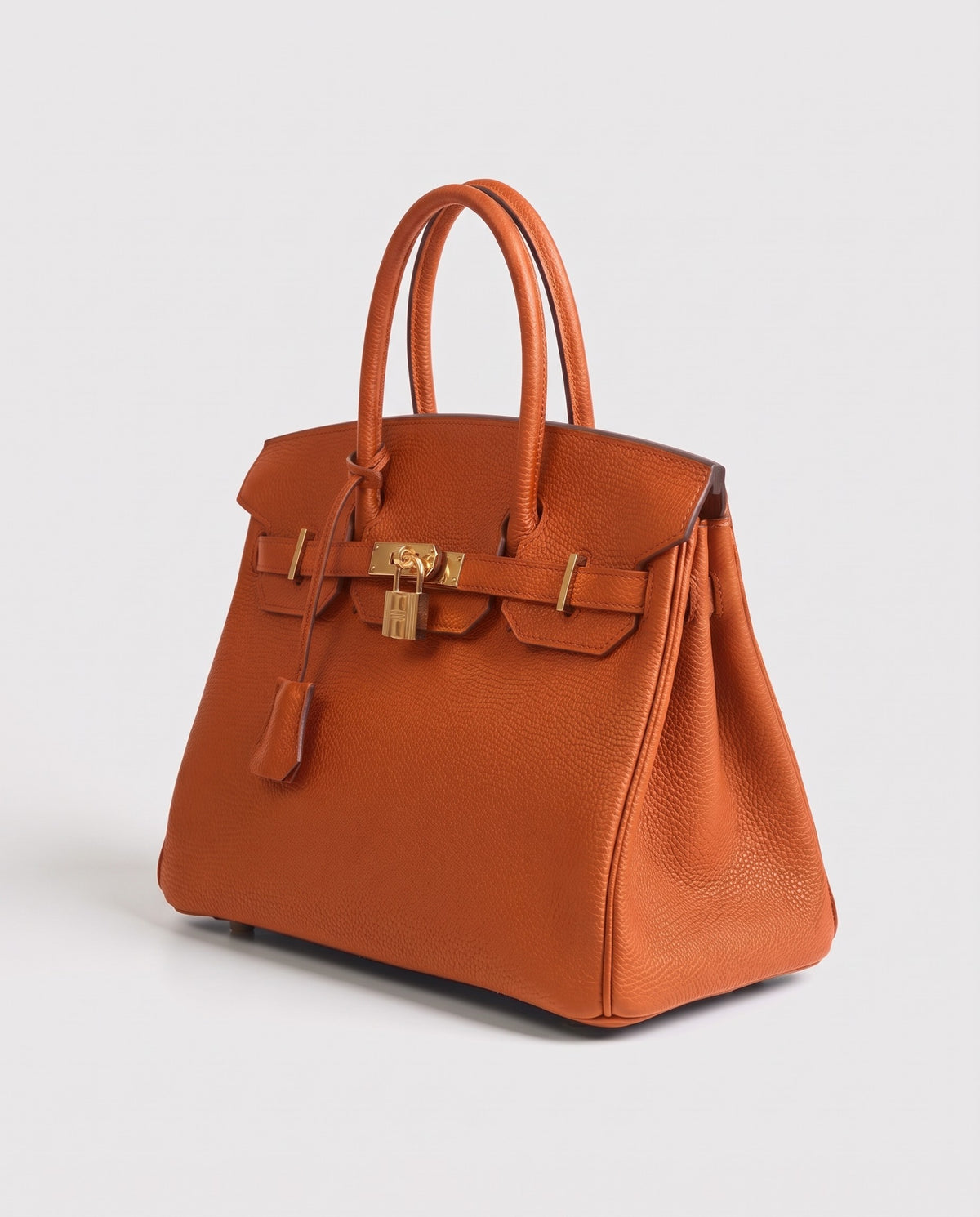 Lock Medium leather top-handle bag in Terracotta – three-quarter view