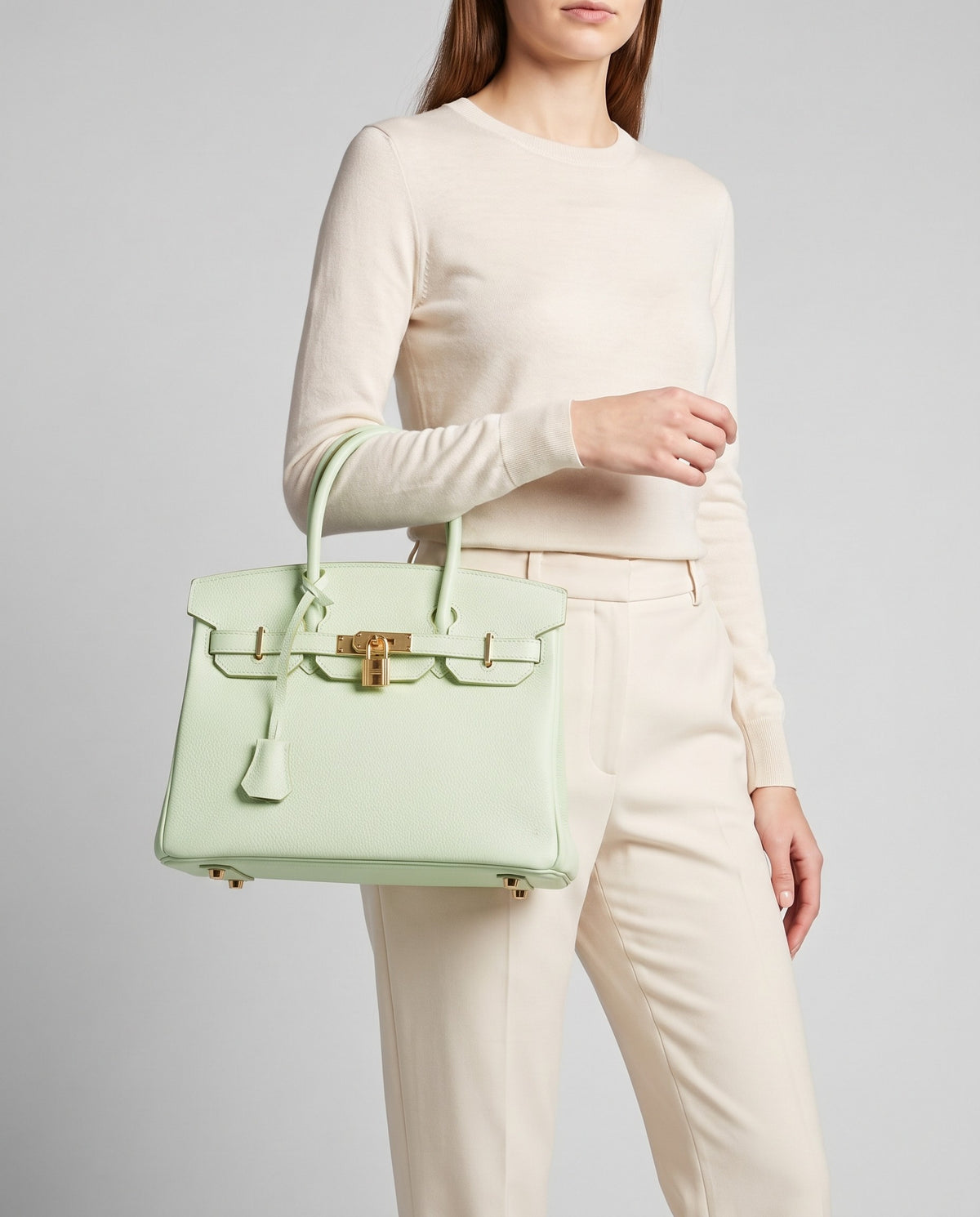 Lock Small leather top-handle bag in Mint – model carrying it