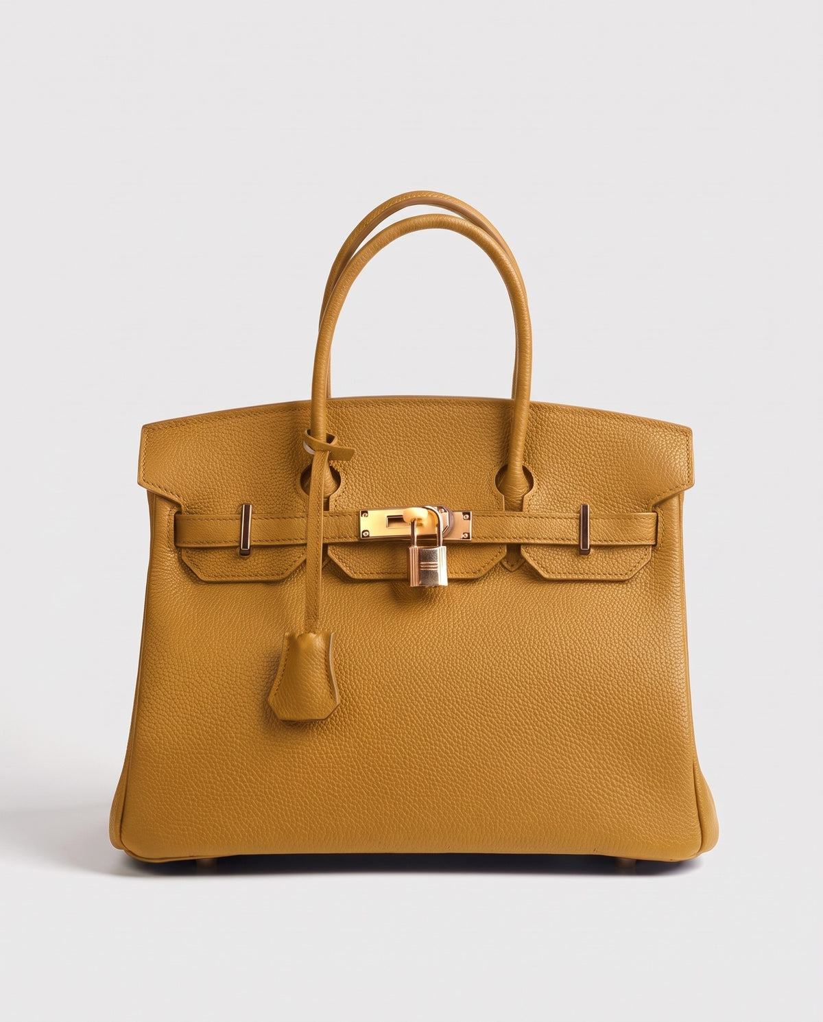 Lock Small leather top-handle bag in Mustard – front view