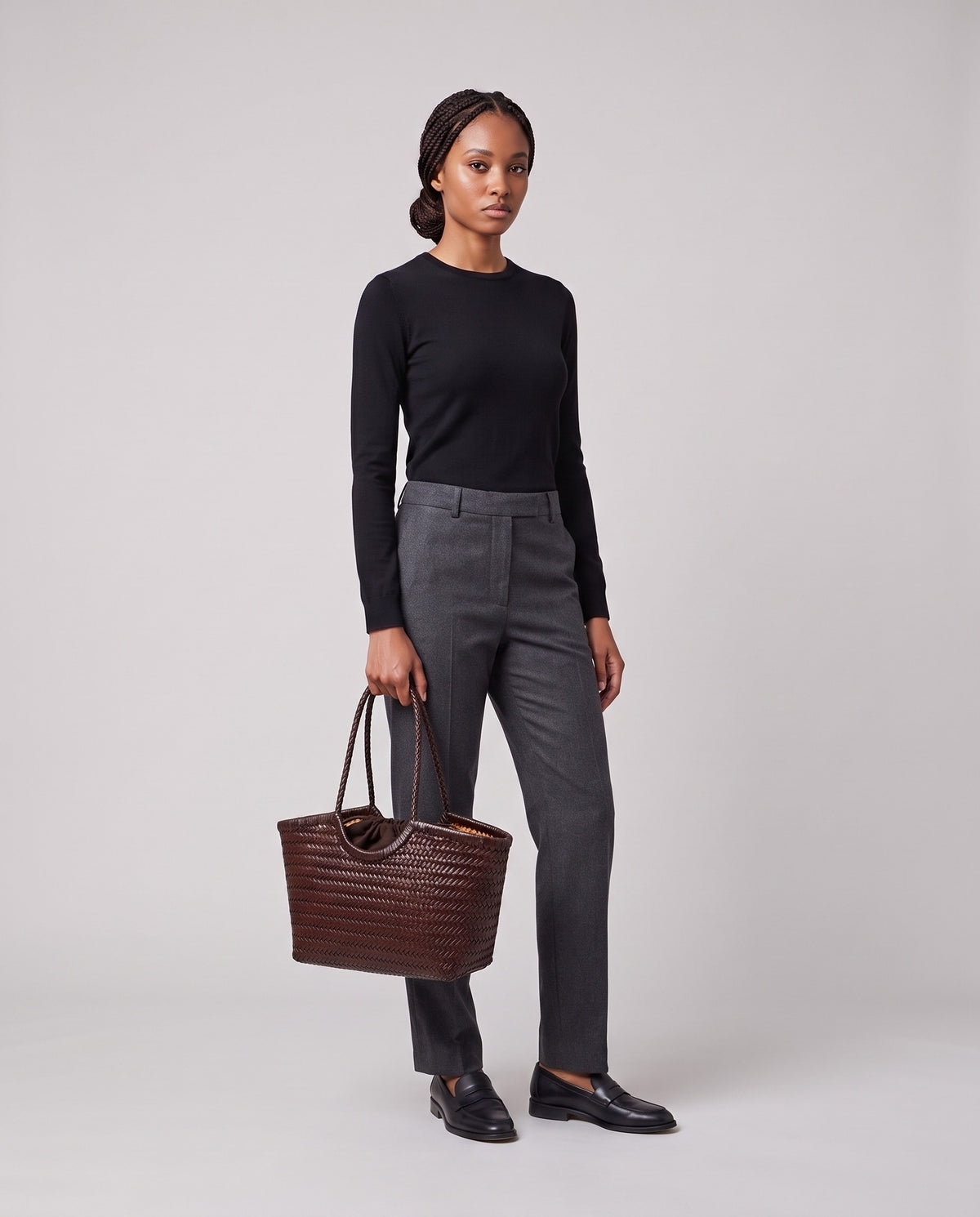 Model holding the Valentina Matera Small bag in Brown, full length