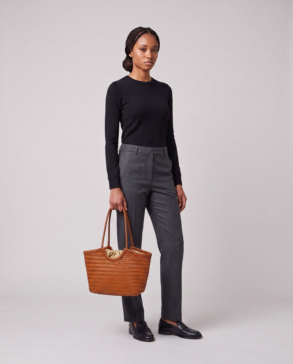 Model holding the Valentina Matera Small bag in Caramel, full length