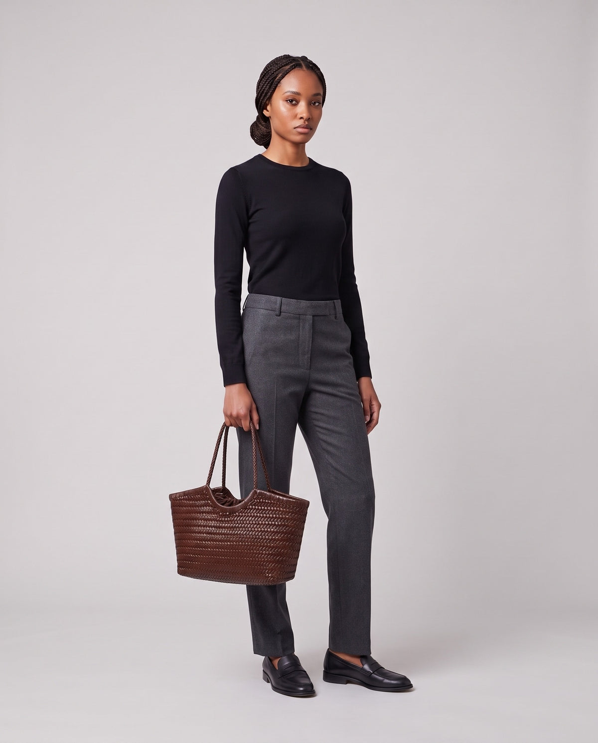 Model holding the Valentina Matera Small bag in Chocolate, full length
