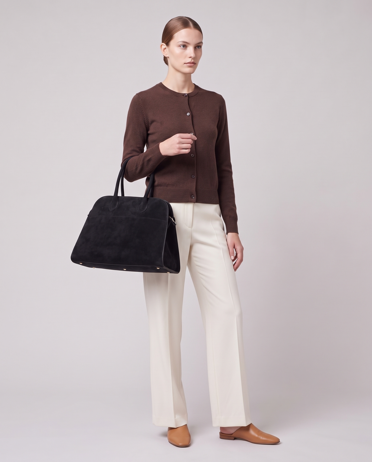 Model carrying the Milano Large bag in Jet black suede – full length