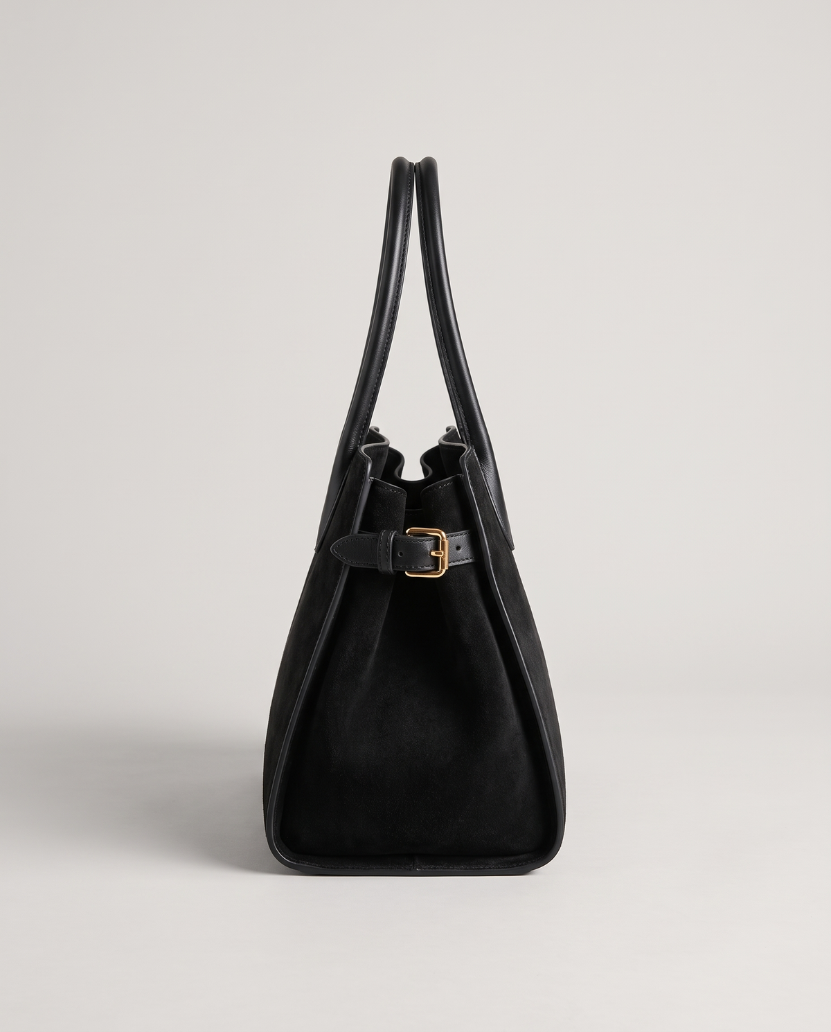 Milano Small top-handle bag in Jet suede – side view showing the buckled side strap