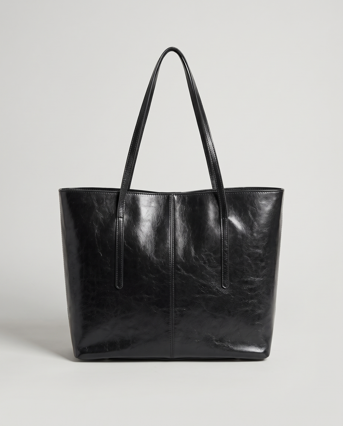 Molo oil-waxed leather tote in black, front view