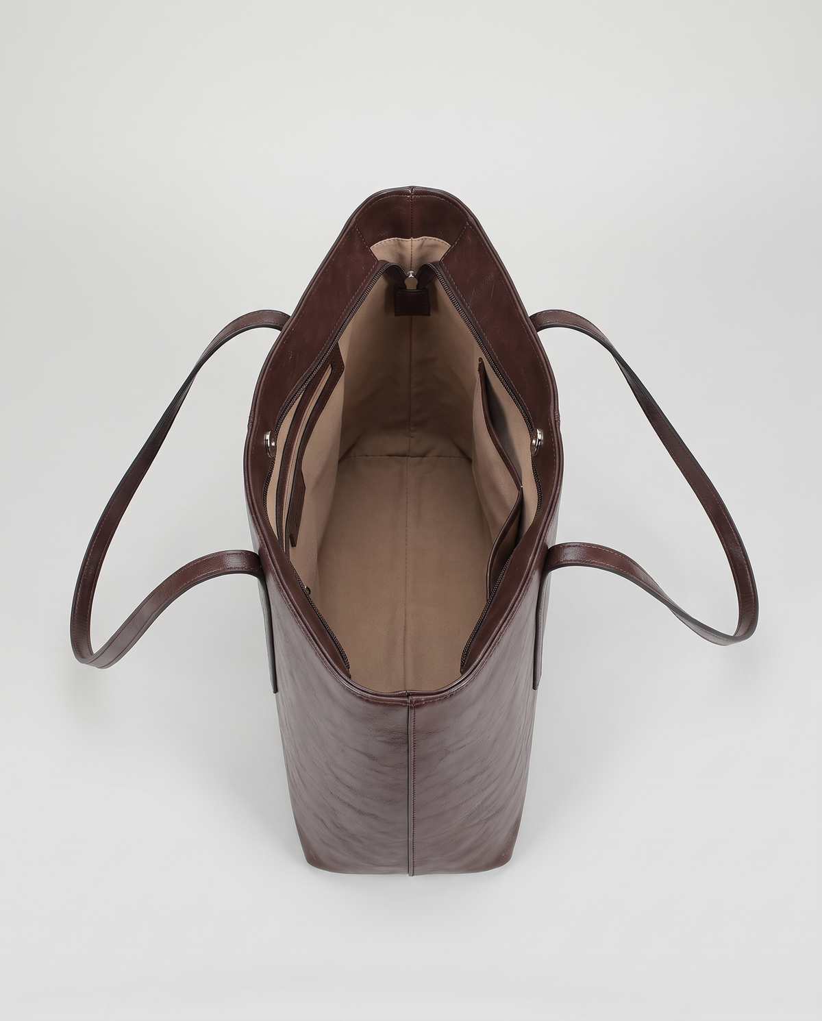 Molo oil-waxed leather tote in chocolate, open showing interior