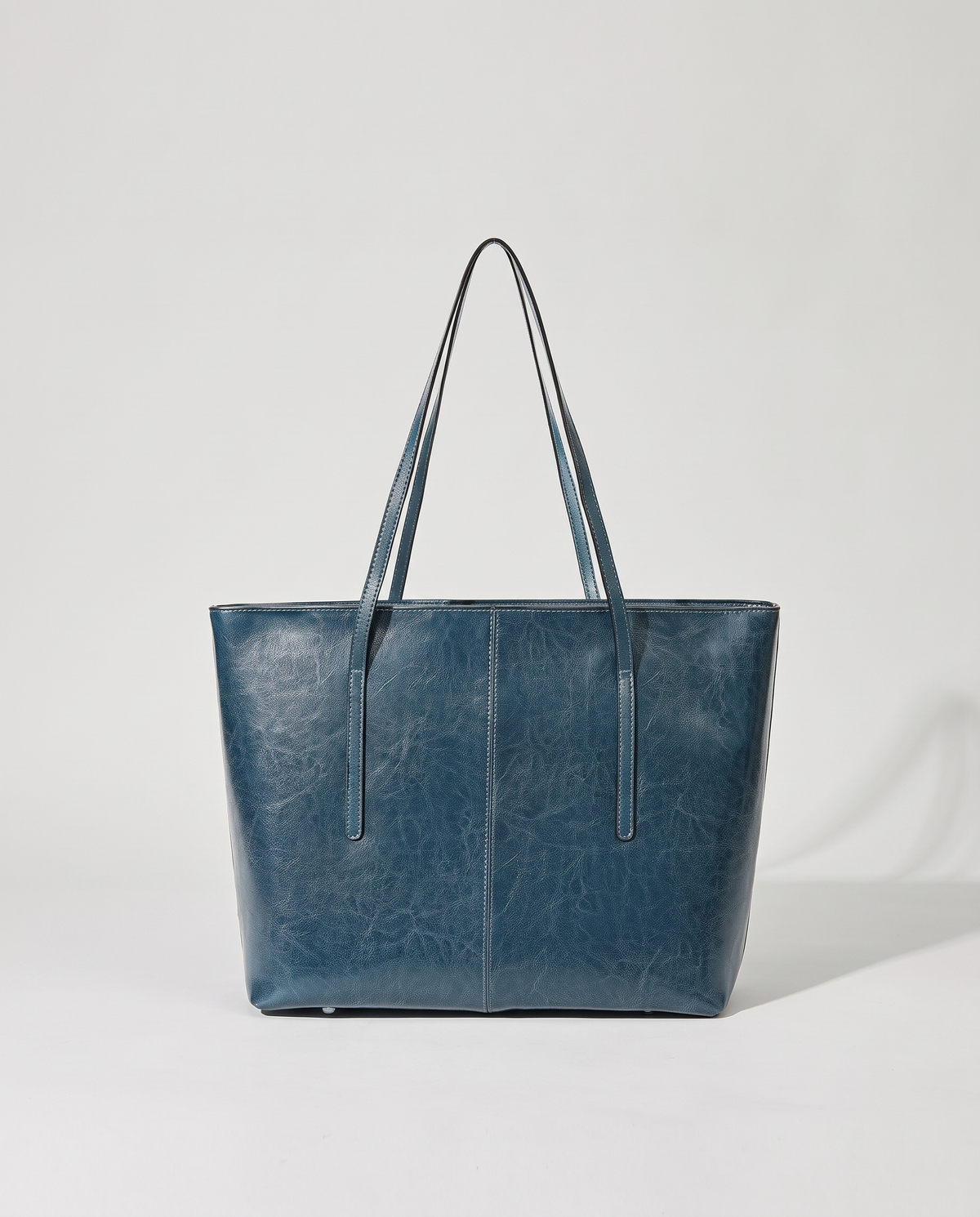 Molo oil-waxed leather tote in denim, front view