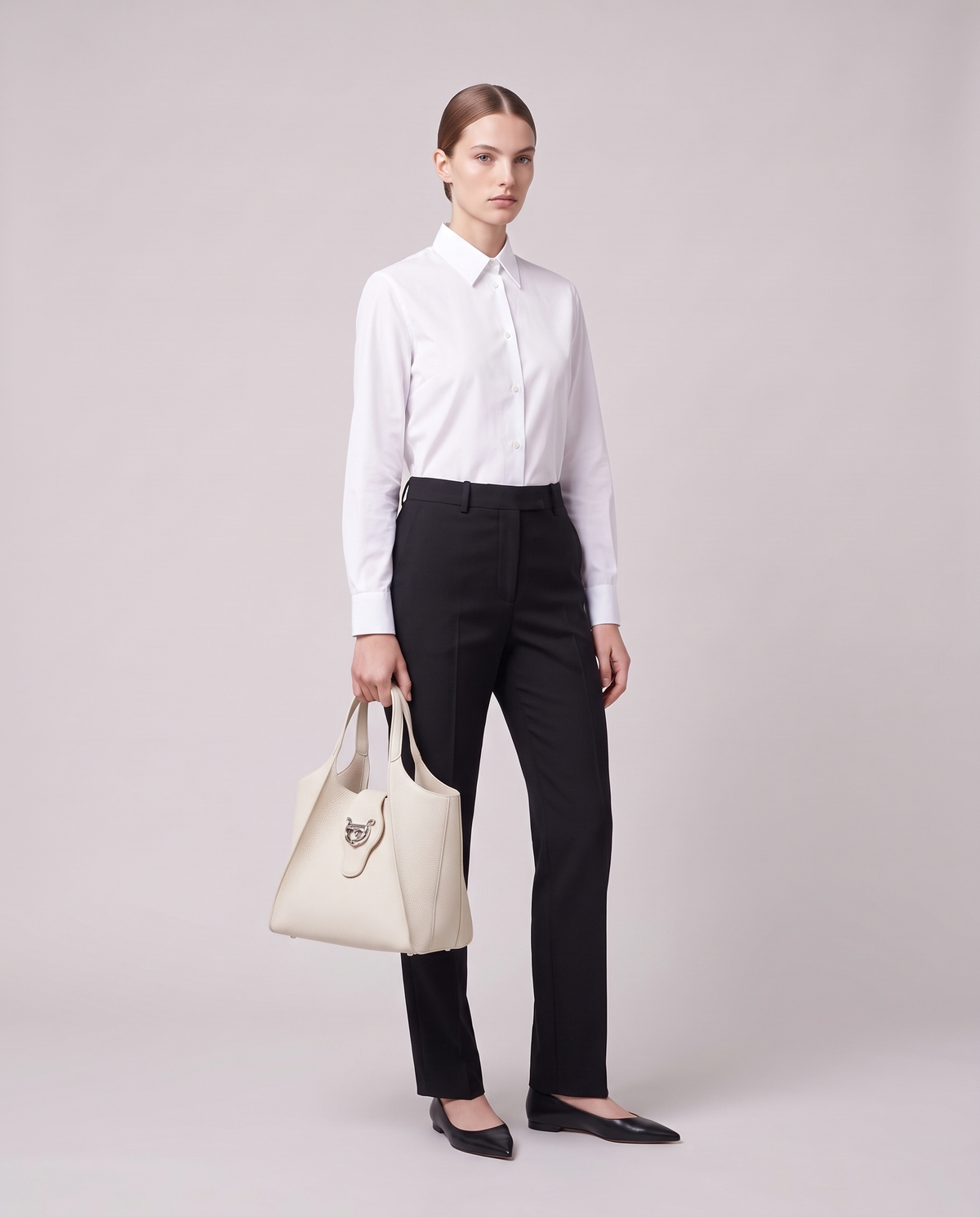Model carrying the Onda leather tote in Ivory – full length