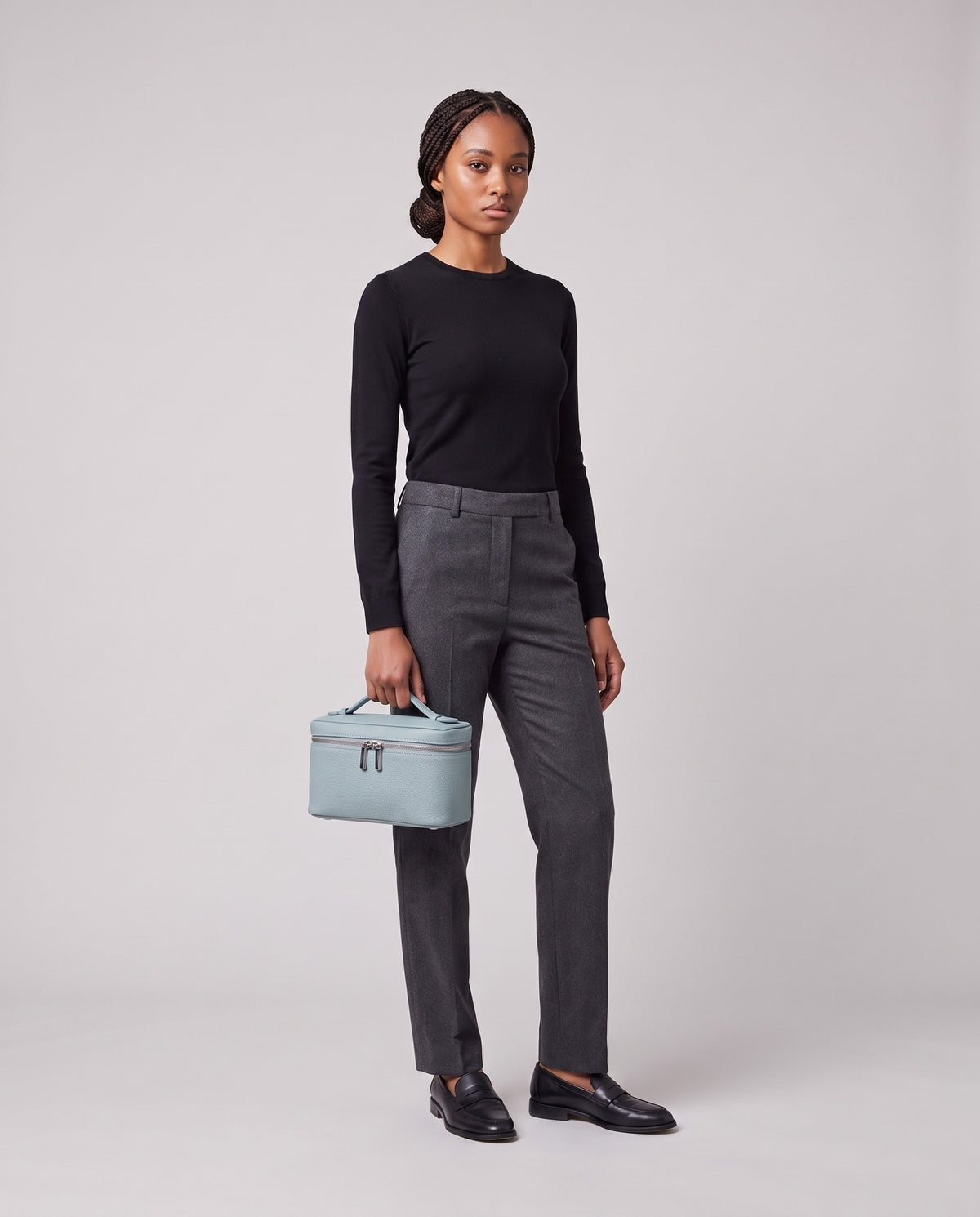 Model holding the Valentina Orvieto Small top-handle bag in Blue leather, full length
