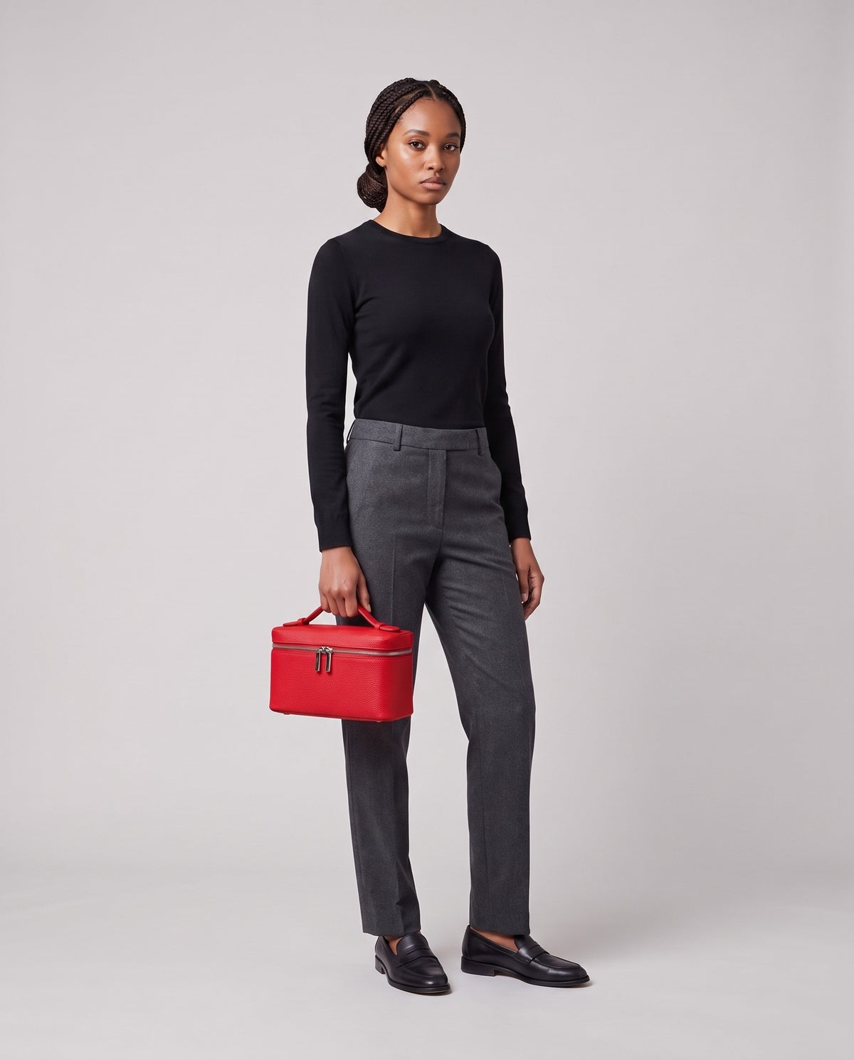 Model holding the Valentina Orvieto Small top-handle bag in Red leather, full length