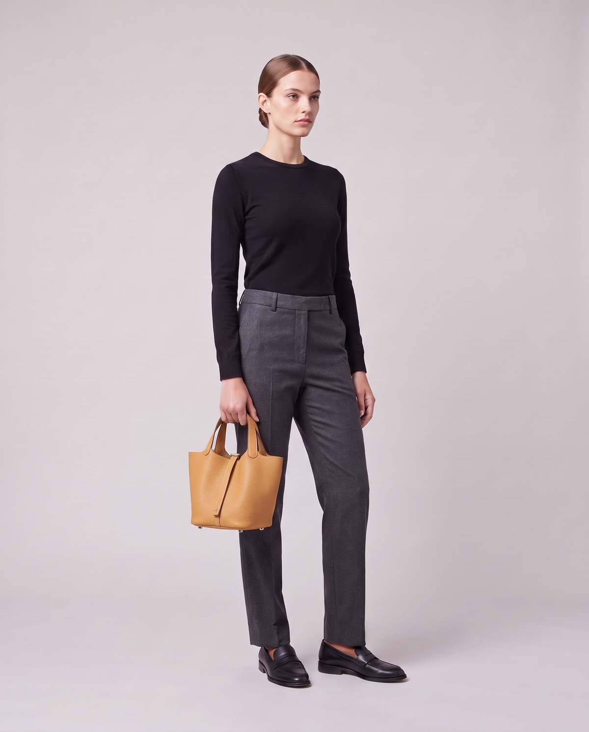 Model holding the Valentina Ostuni Large bag in Apricot, full length