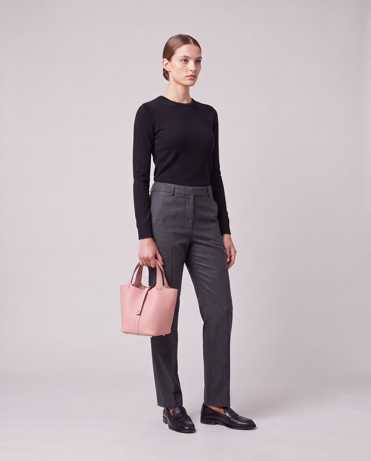 Model holding the Valentina Ostuni Large bag in Blush, full length