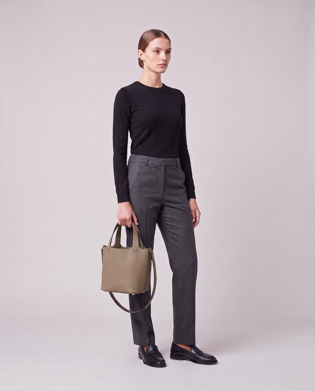 Model holding the Valentina Ostuni Small bag in Denim, full length