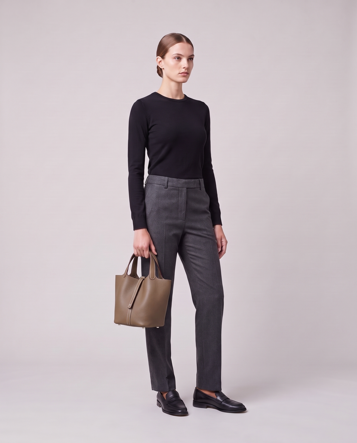 Model holding the Valentina Ostuni Small bag in Taupe, full length