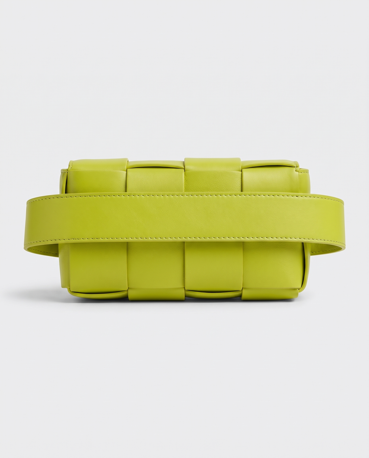 Cassette padded woven leather belt bag in Lime – back view showing the belt strap