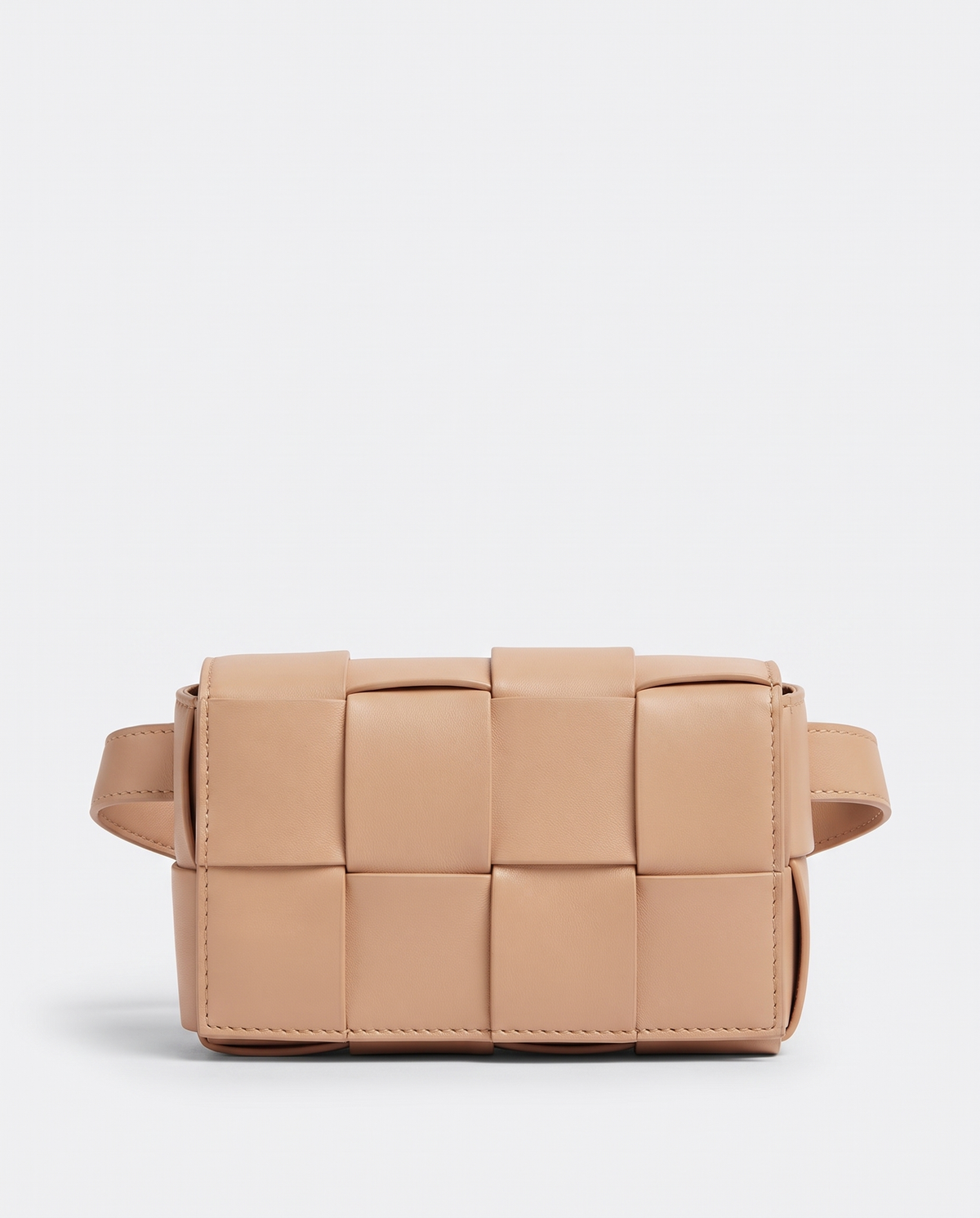 Cassette padded woven leather belt bag in Nude – front view