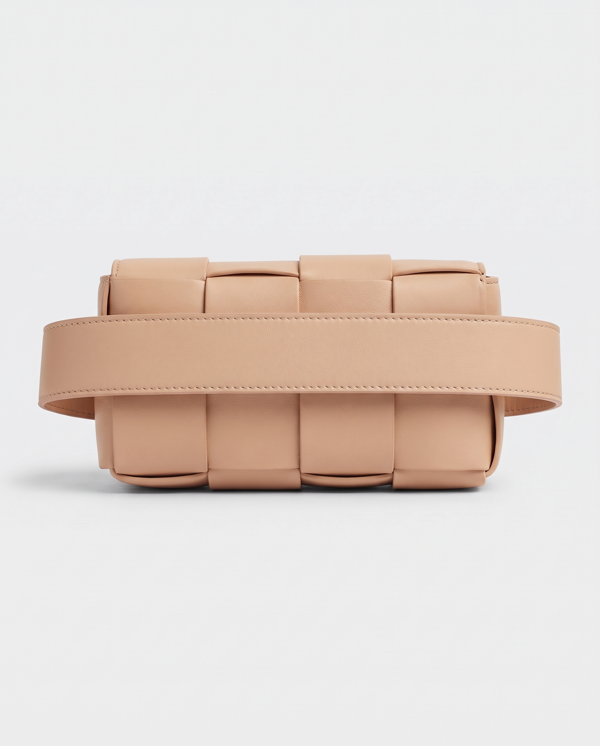 Cassette padded woven leather belt bag in Nude – back view showing the belt strap