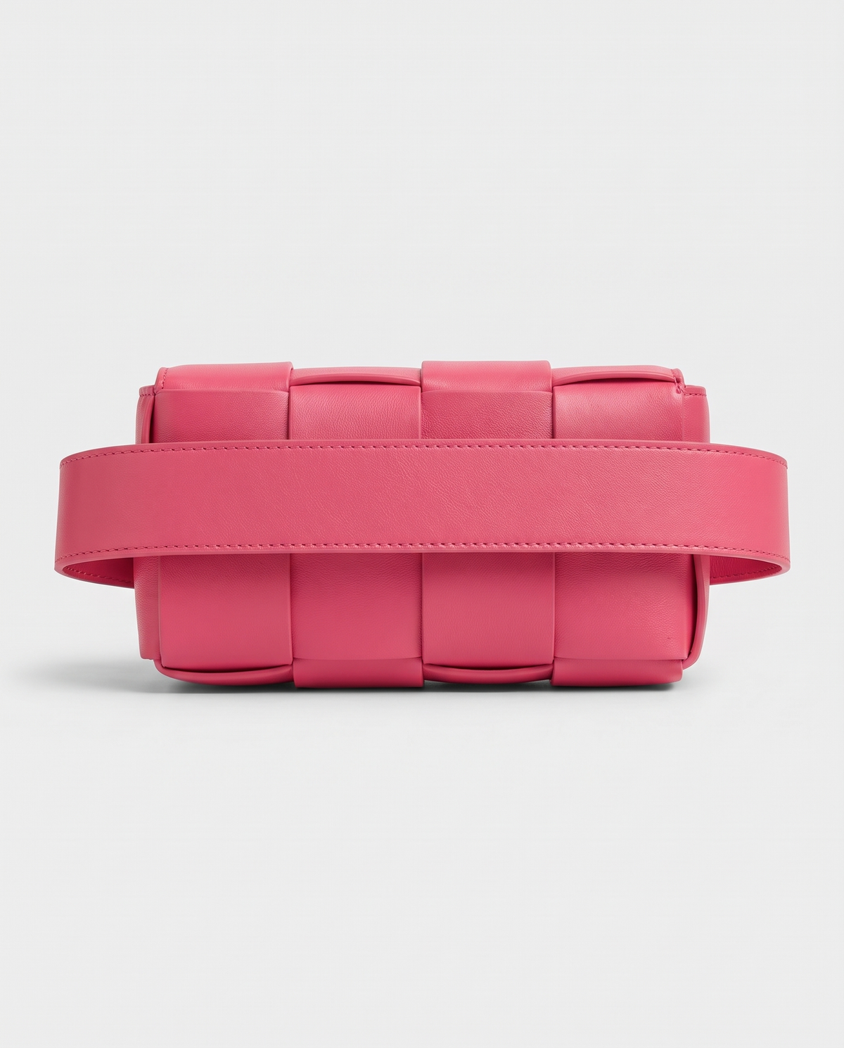 Cassette padded woven leather belt bag in Pink – back view showing the belt strap