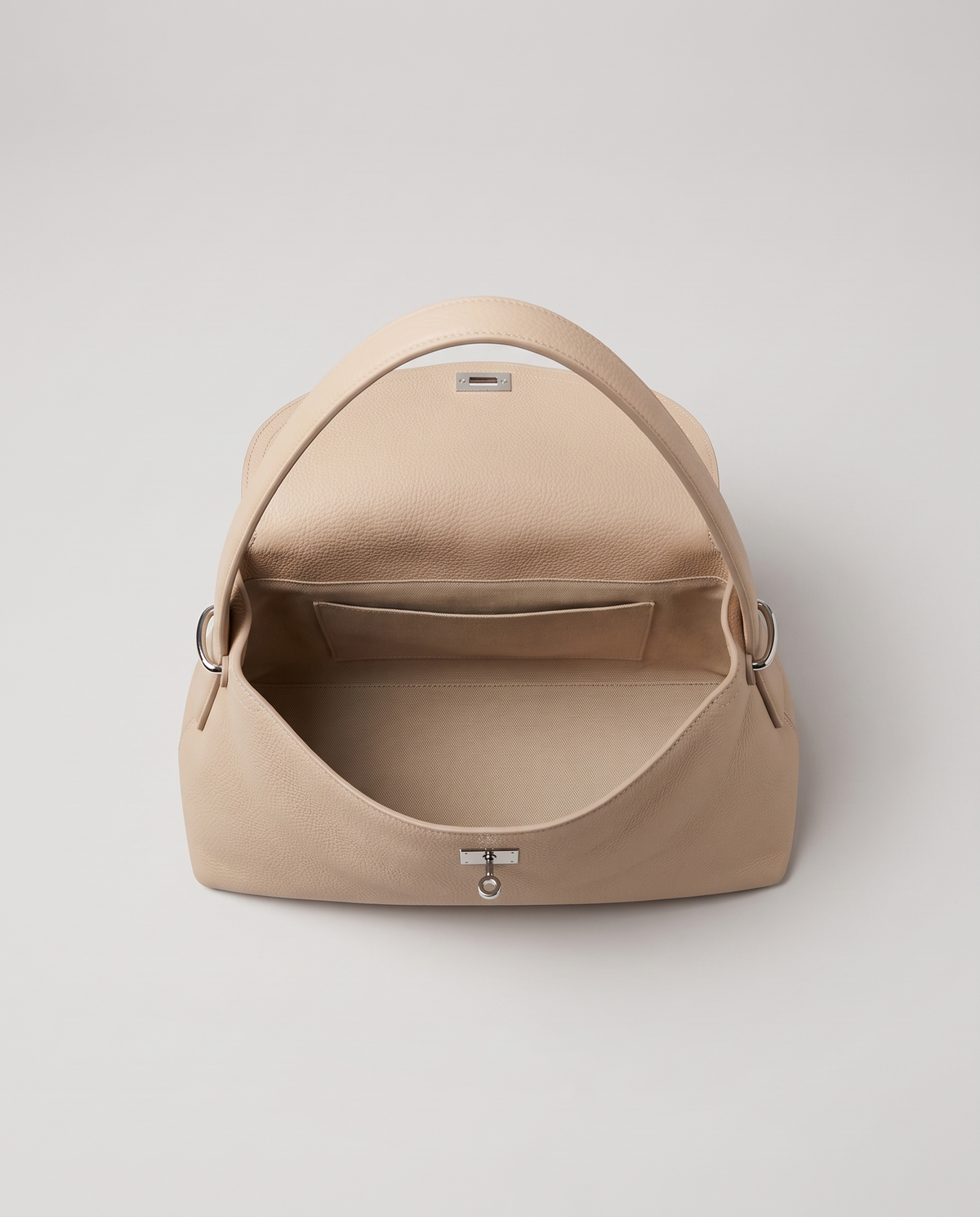 Porto top-handle bag in beige, flap open showing interior