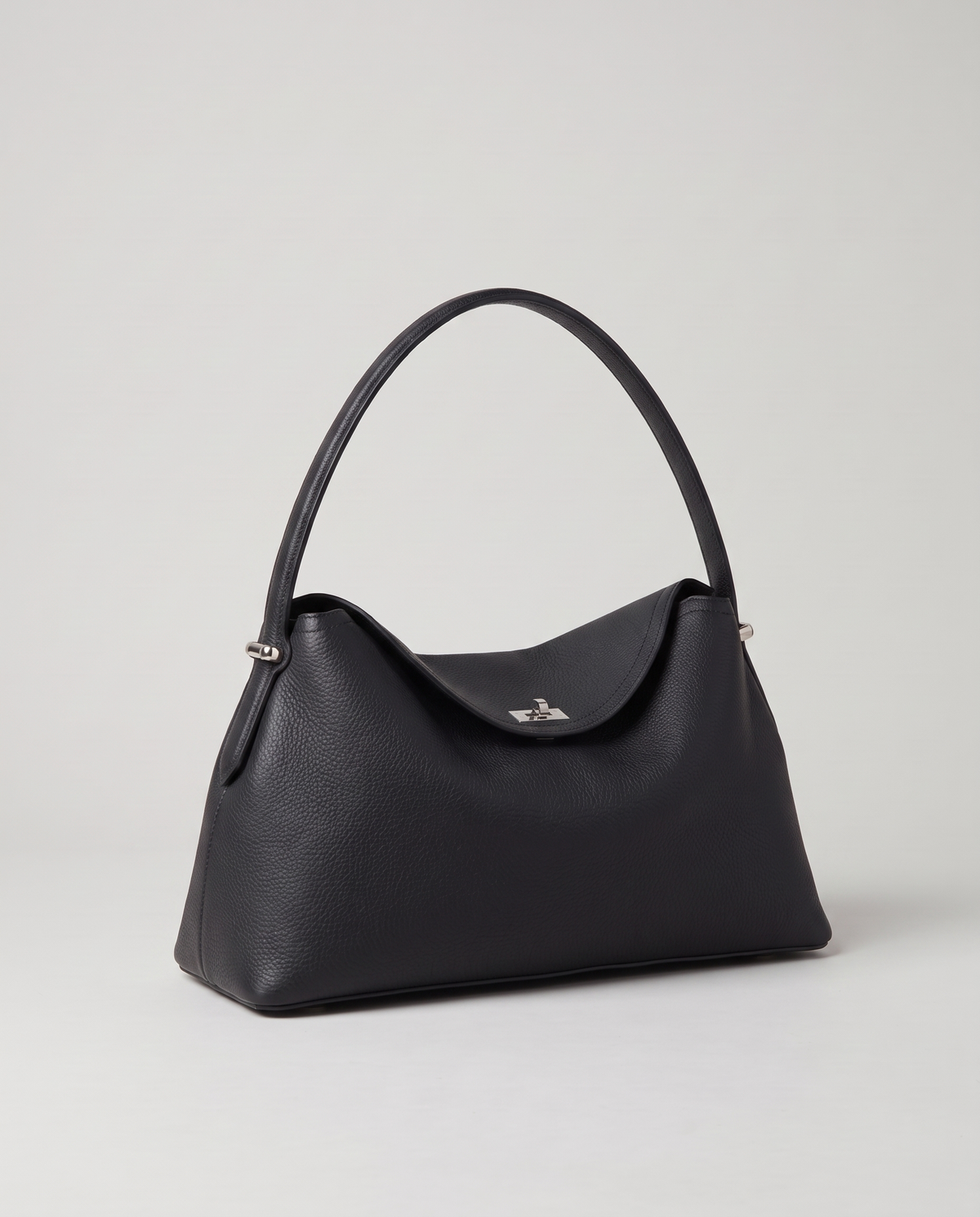 Porto pebbled leather top-handle bag in black, three-quarter view