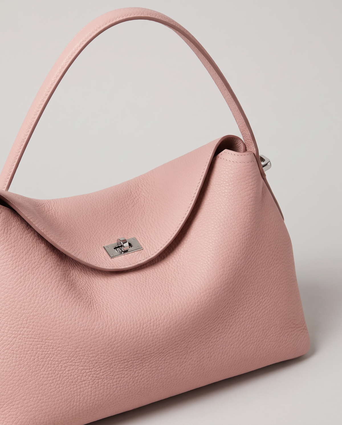 Porto pebbled leather top-handle bag in blush, hardware and leather detail