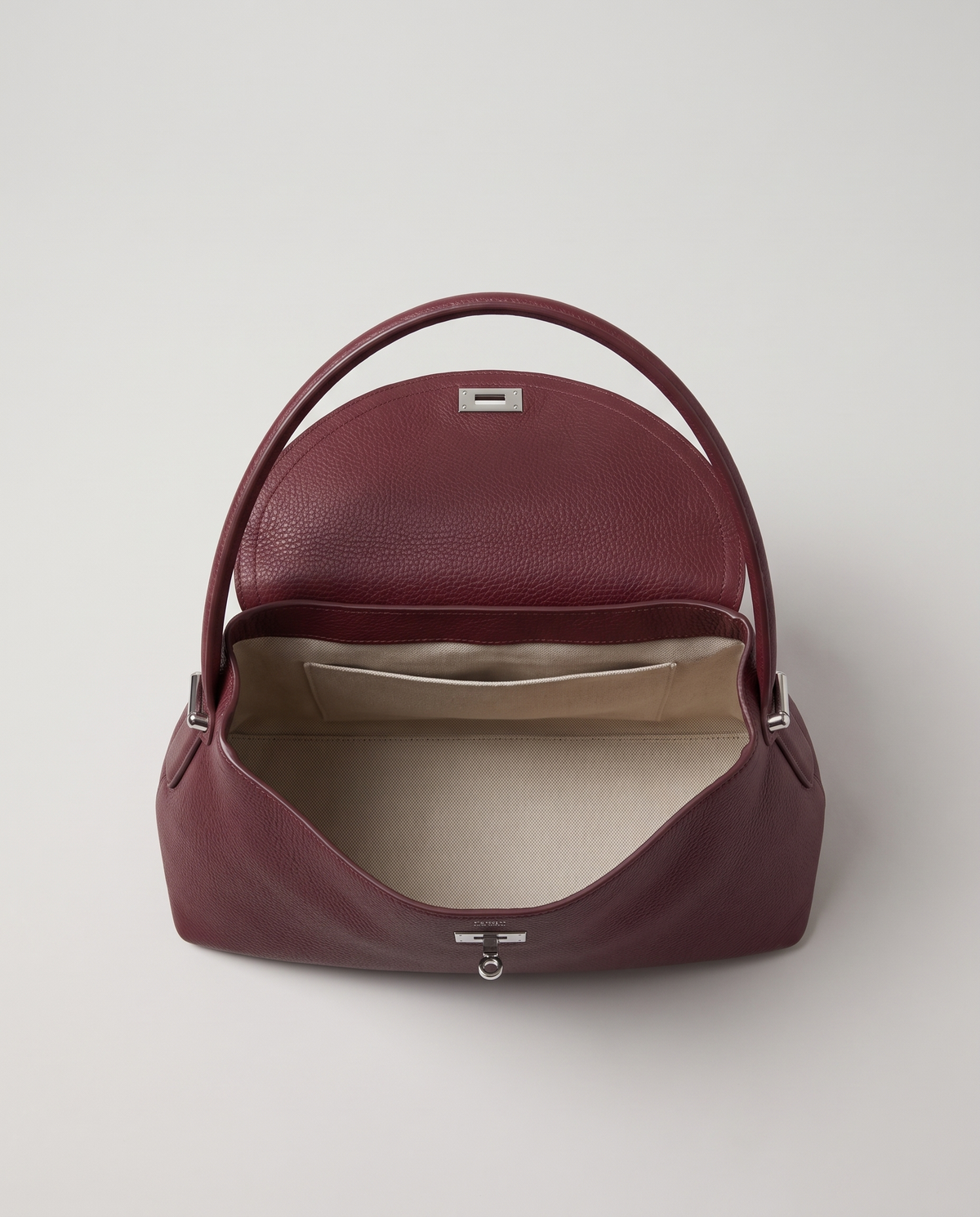 Porto pebbled leather top-handle bag in burgundy, open showing interior