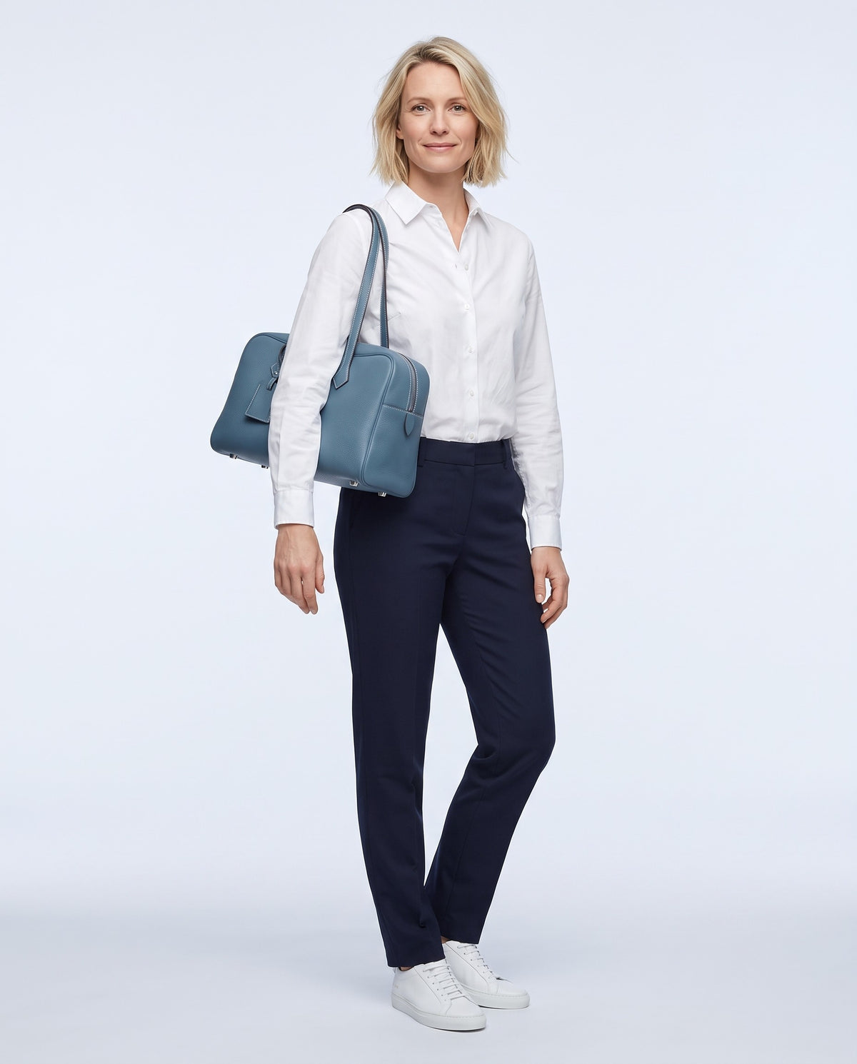 Model wearing the Portofino bowling bag in Denim – full-length view