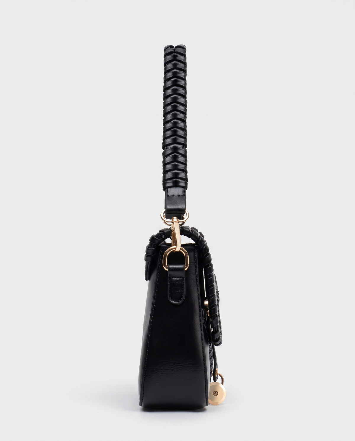 Saddle vegan leather shoulder bag in Black – side view showing the braided strap