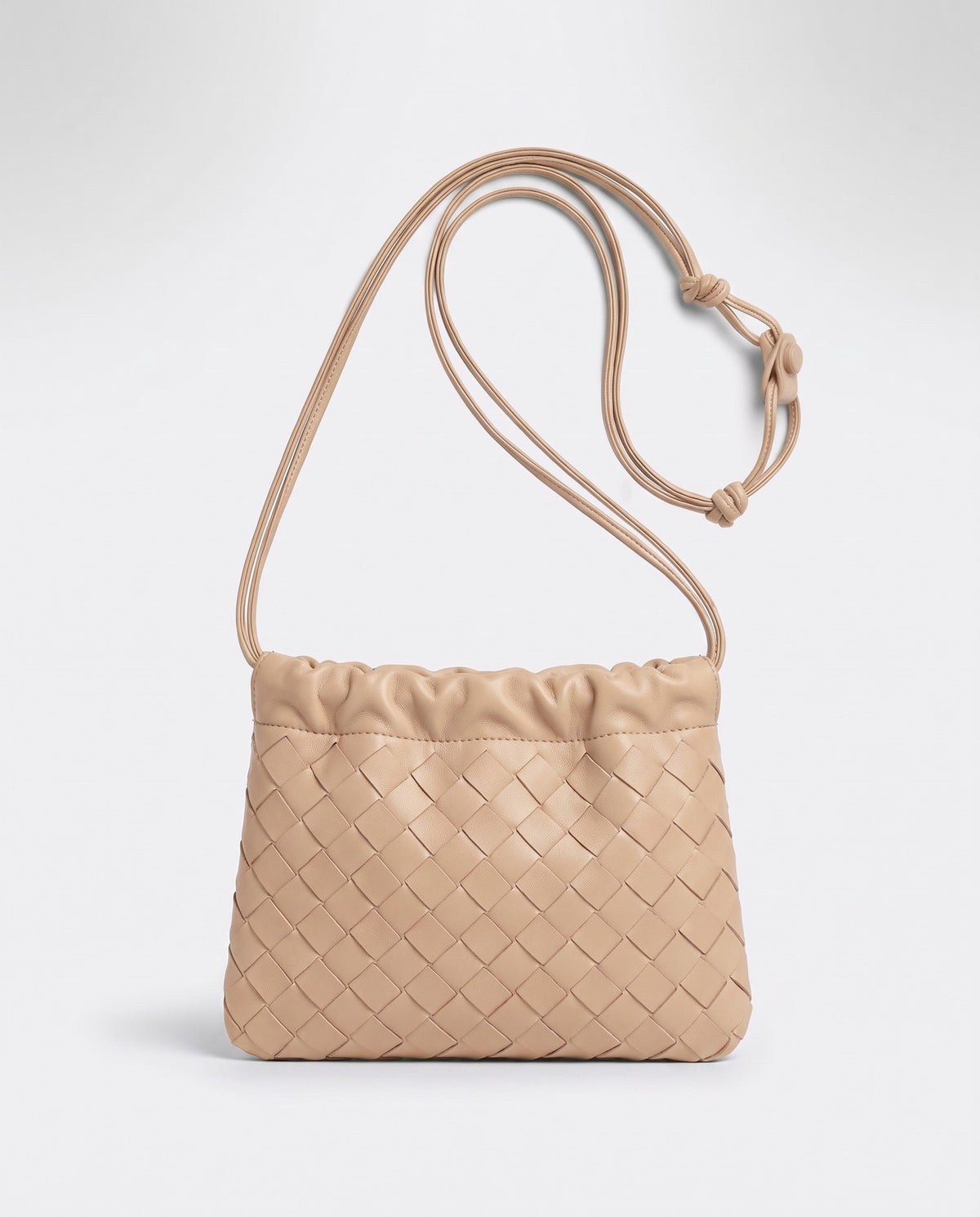 Serata woven leather clutch in Beige – front view
